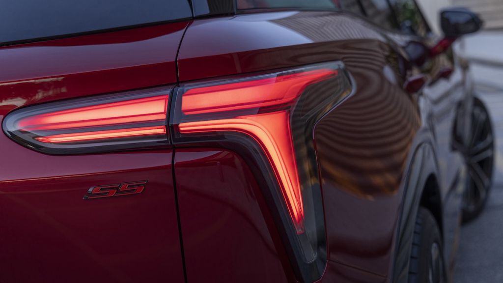 Close up of passenger’s side taillight and SS badge on 2024 Chevrolet Blazer EV SS in Radiant Red Tintcoat. Preproduction model shown. Actual production model may vary. 2024 Chevrolet Blazer EV available Spring 2023.